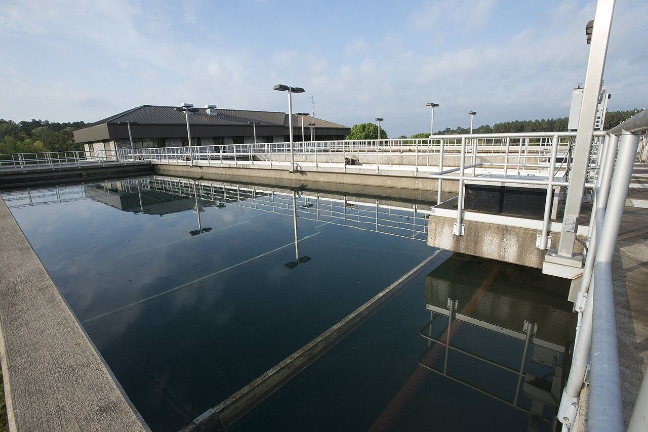 Stainless vessels and utility headers at a treatment plant, shown as the kind of continuous equipment this work sits beside.